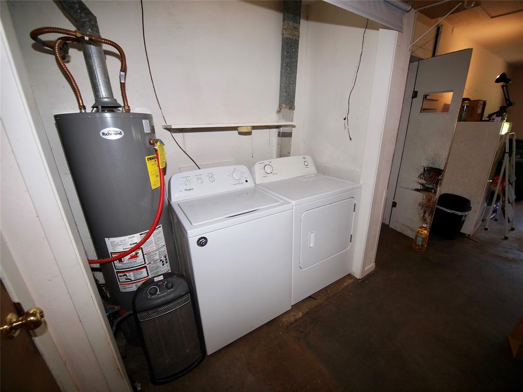 1441 Brazos Street Graham, TX 76450 - Photo 26 of 34 a view of storage and utility room with two washing machine