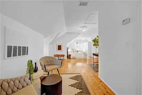 a living room with furniture and a rug
