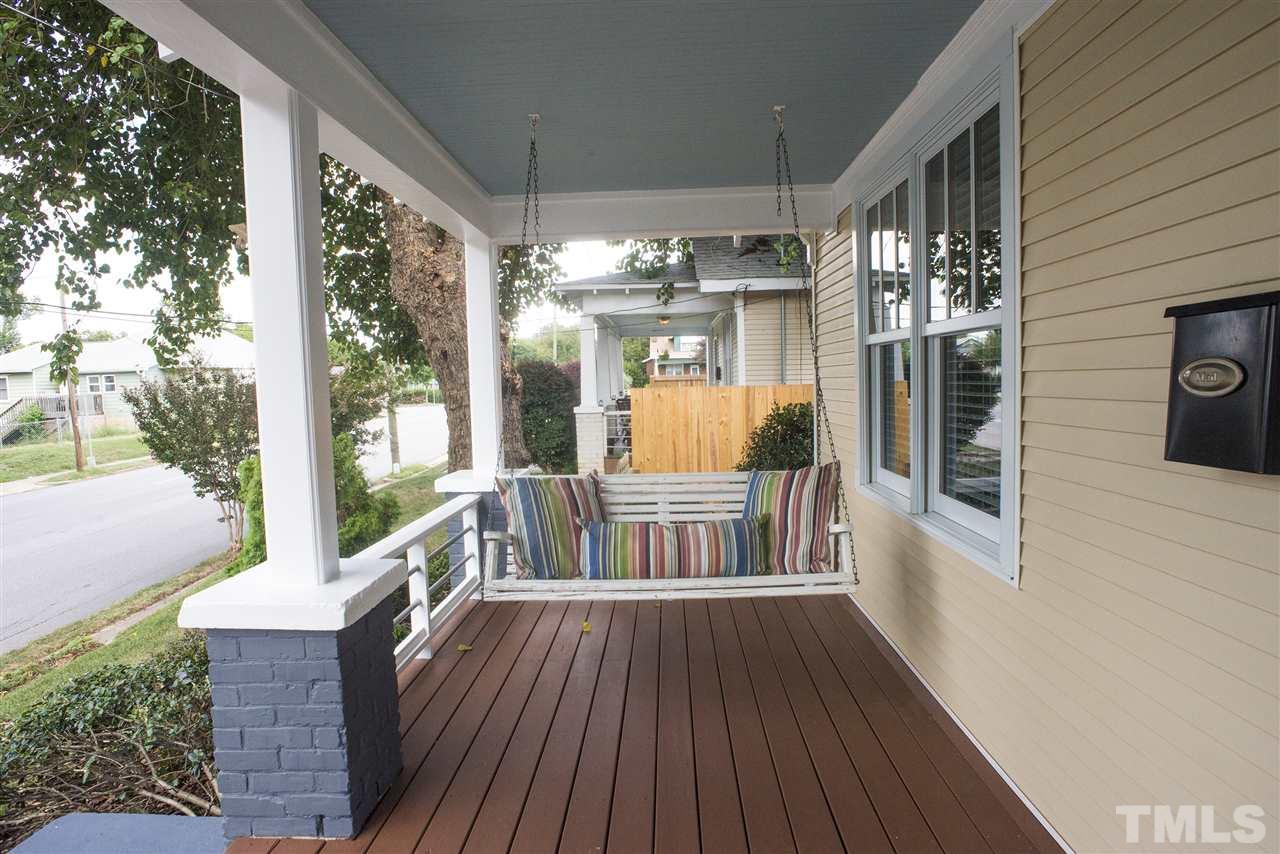 702 East Edenton Street Raleigh, NC 27601 - Photo 2 of 19 a view of a porch with wooden floor and outdoor space