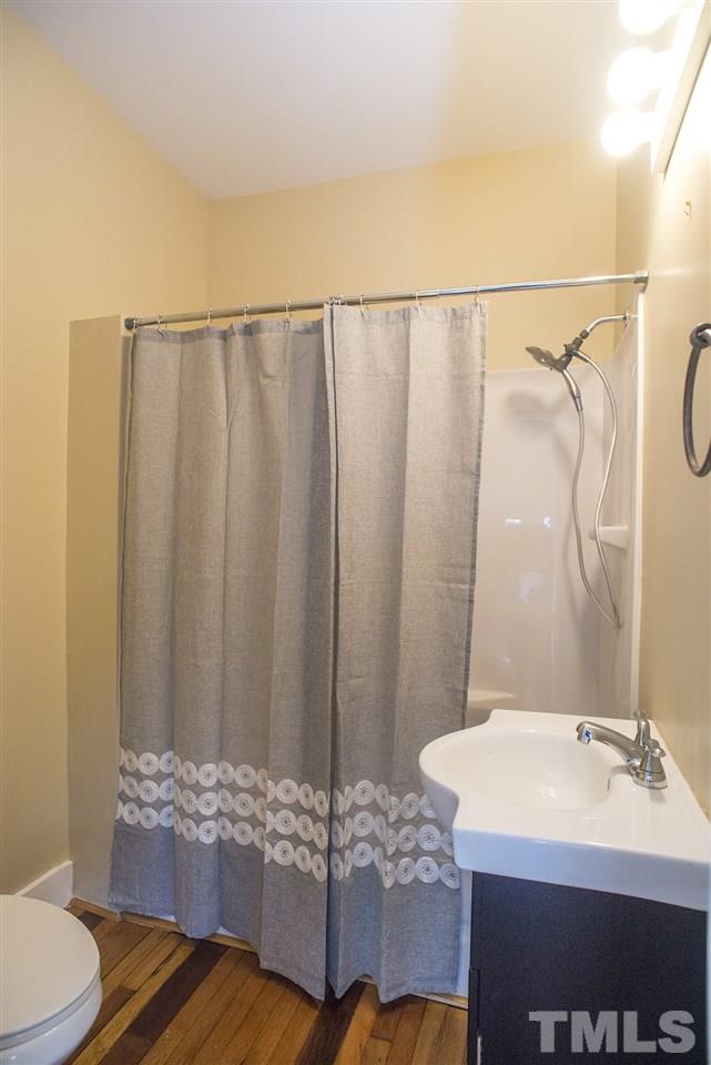 702 East Edenton Street Raleigh, NC 27601 - Photo 15 of 19 a bathroom with a sink and a mirror