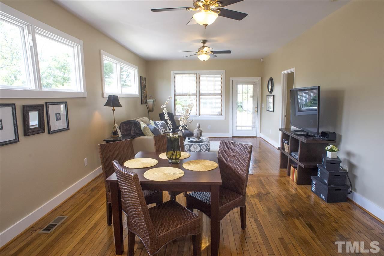 702 East Edenton Street Raleigh, NC 27601 - Photo 7 of 19 a view of a dining room with furniture window and wooden floor