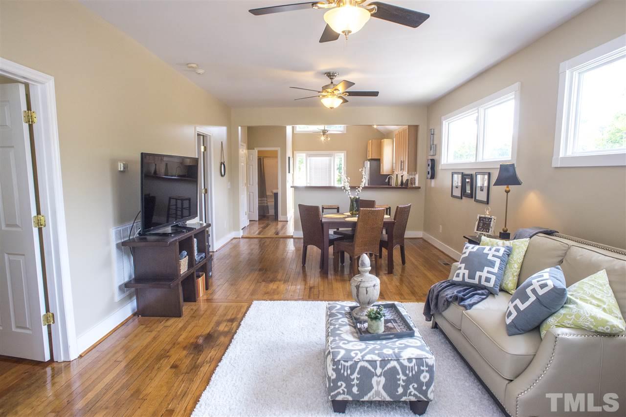 702 East Edenton Street Raleigh, NC 27601 - Photo 9 of 19 a living room with furniture and a chandelier