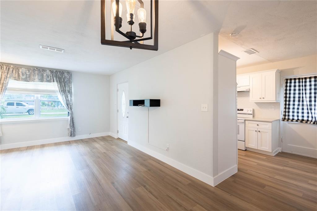314 4th Avenue Southwest Ruskin, FL 33570 - Photo 7 of 30 a view of a kitchen with wooden floor and white cabinets