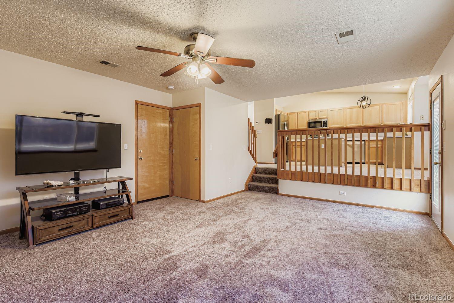 10505 Hyacinth Place Highlands Ranch, CO 80129 - Photo 16 of 40 a view of livingroom with furniture and windows