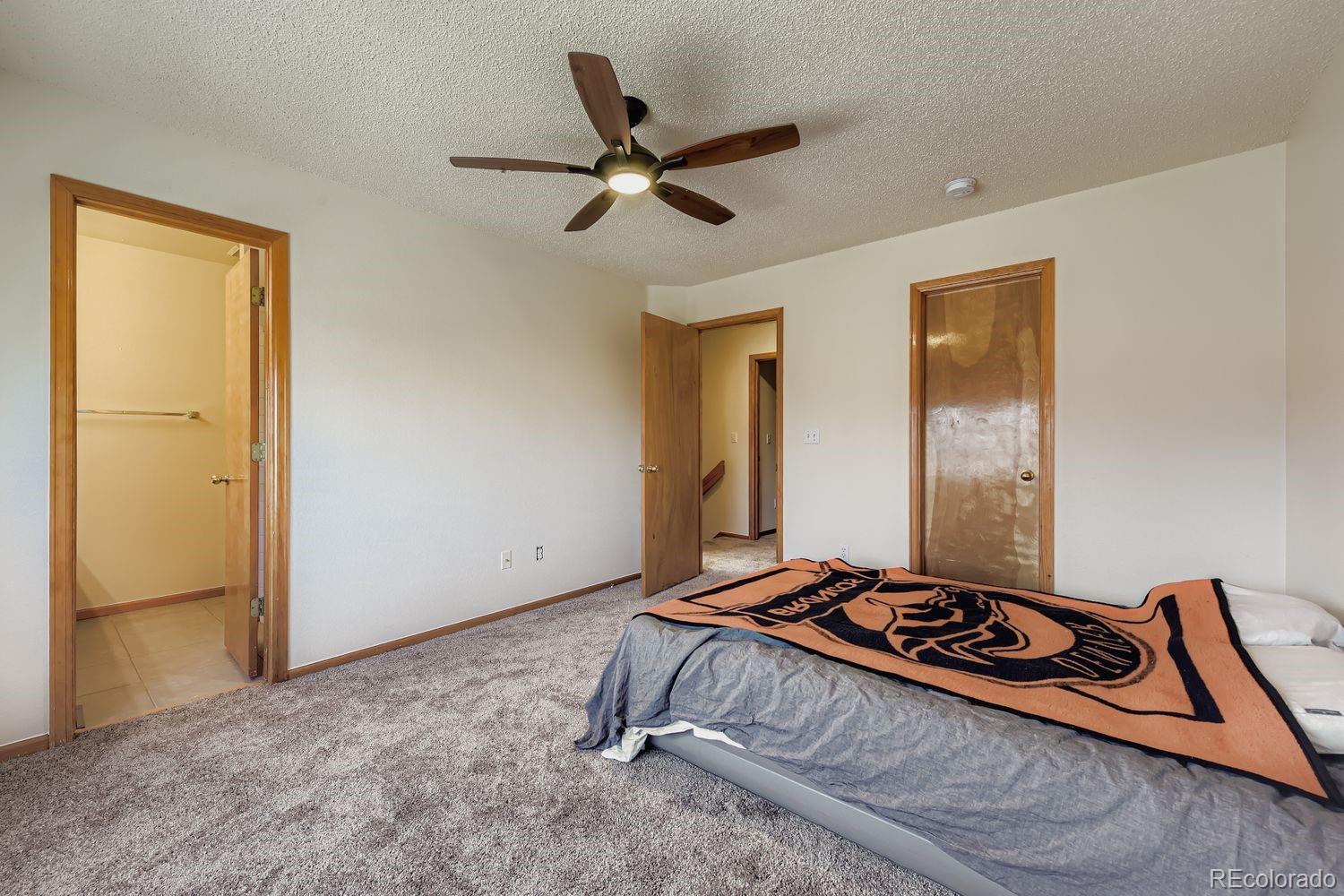 10505 Hyacinth Place Highlands Ranch, CO 80129 - Photo 20 of 40 a living room with a bed and a window