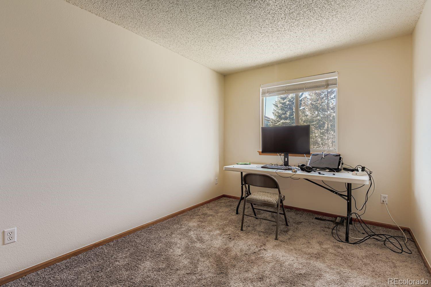10505 Hyacinth Place Highlands Ranch, CO 80129 - Photo 23 of 40 a view of a workspace with a window
