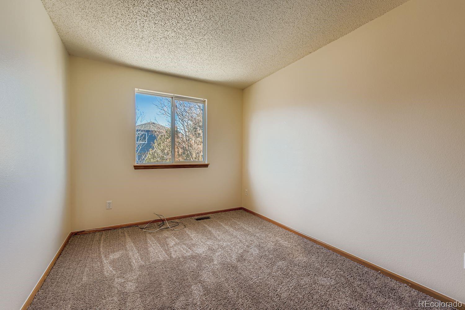 10505 Hyacinth Place Highlands Ranch, CO 80129 - Photo 24 of 40 an empty room with a window