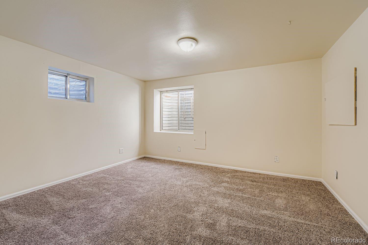 10505 Hyacinth Place Highlands Ranch, CO 80129 - Photo 28 of 40 an empty room with windows