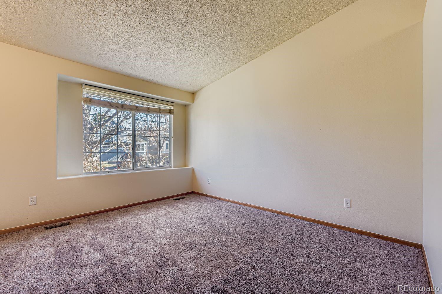 10505 Hyacinth Place Highlands Ranch, CO 80129 - Photo 5 of 40 an empty room with windows