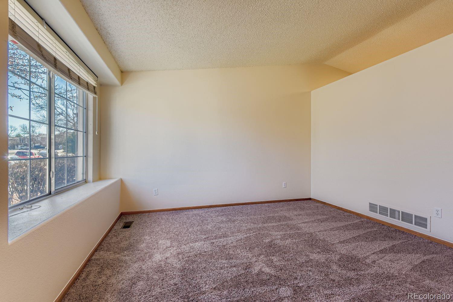 10505 Hyacinth Place Highlands Ranch, CO 80129 - Photo 7 of 40 a view of an empty room with a window