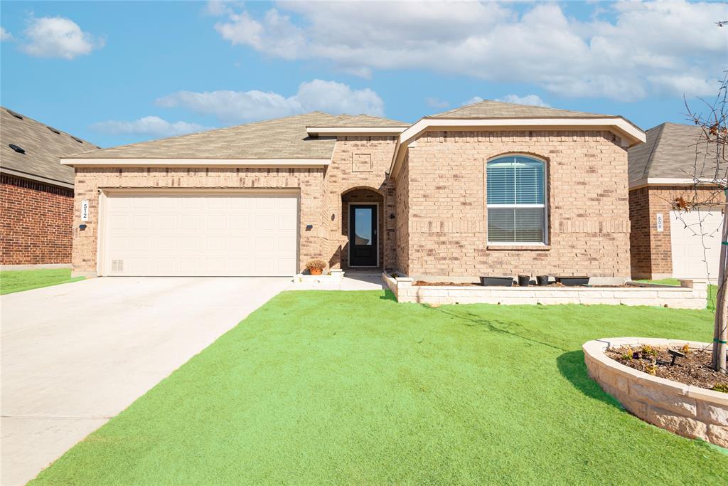 512 Capstone Court Princeton, TX 75407 - Photo 2 of 32 a front view of a house with a garden