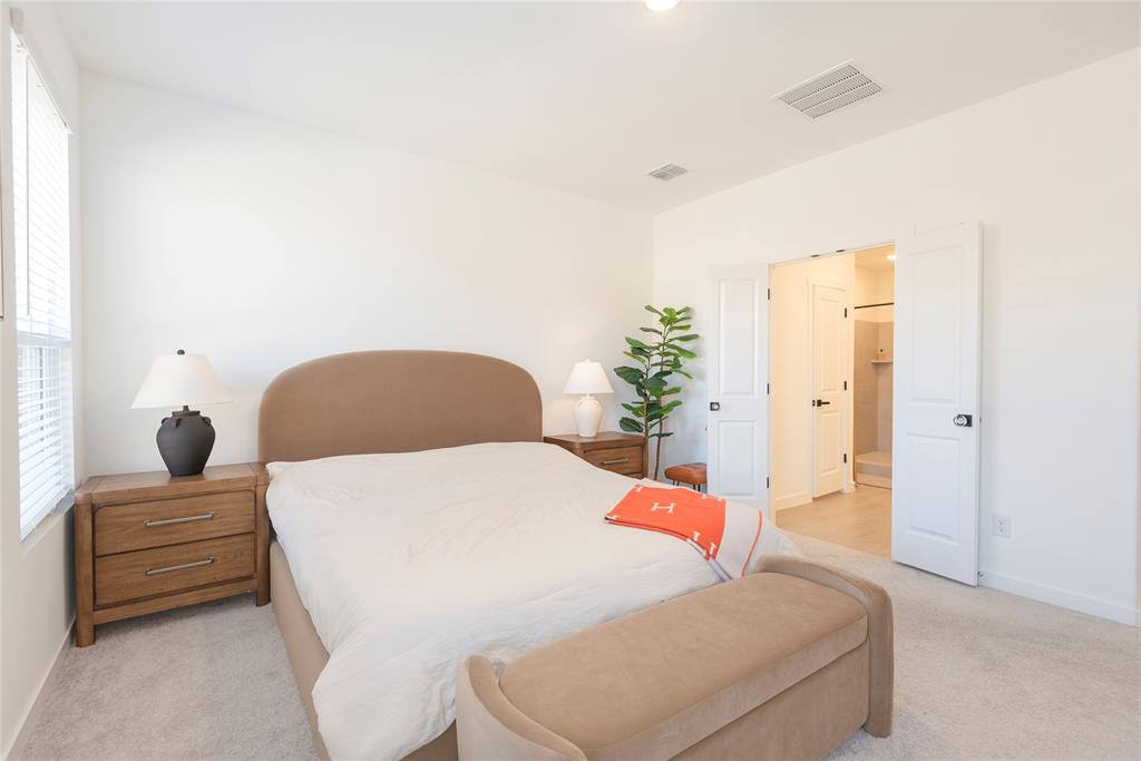 512 Capstone Court Princeton, TX 75407 - Photo 28 of 32 a bedroom with a bed and a dresser