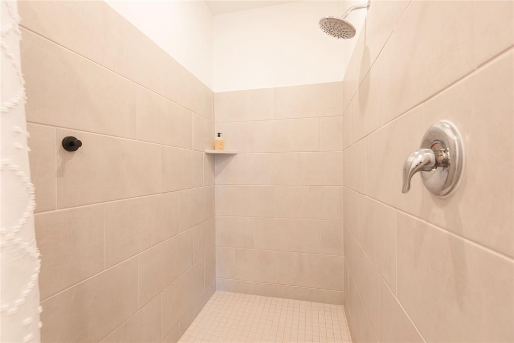 512 Capstone Court Princeton, TX 75407 - Photo 30 of 32 a bathroom with a shower