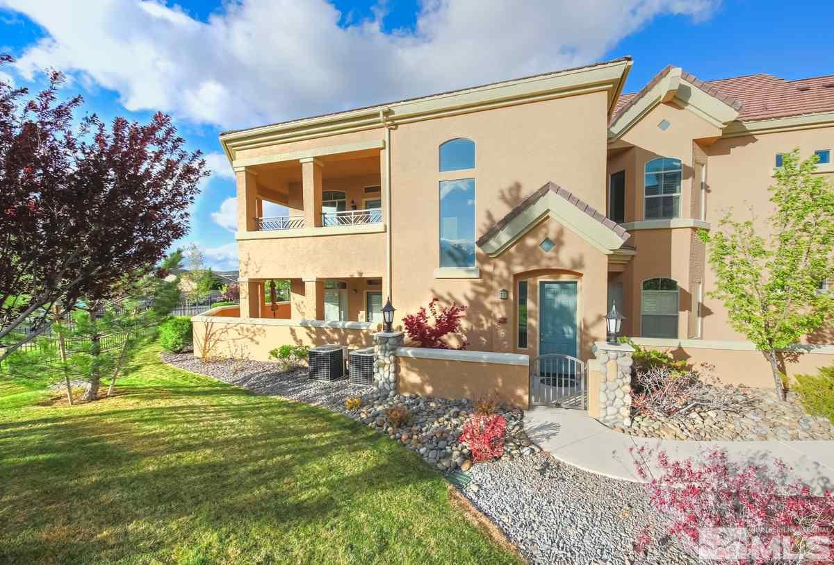 9900 Wilbur May, Unit 104 Reno, NV 89521 - Photo 1 of 1 a front view of a house with garden