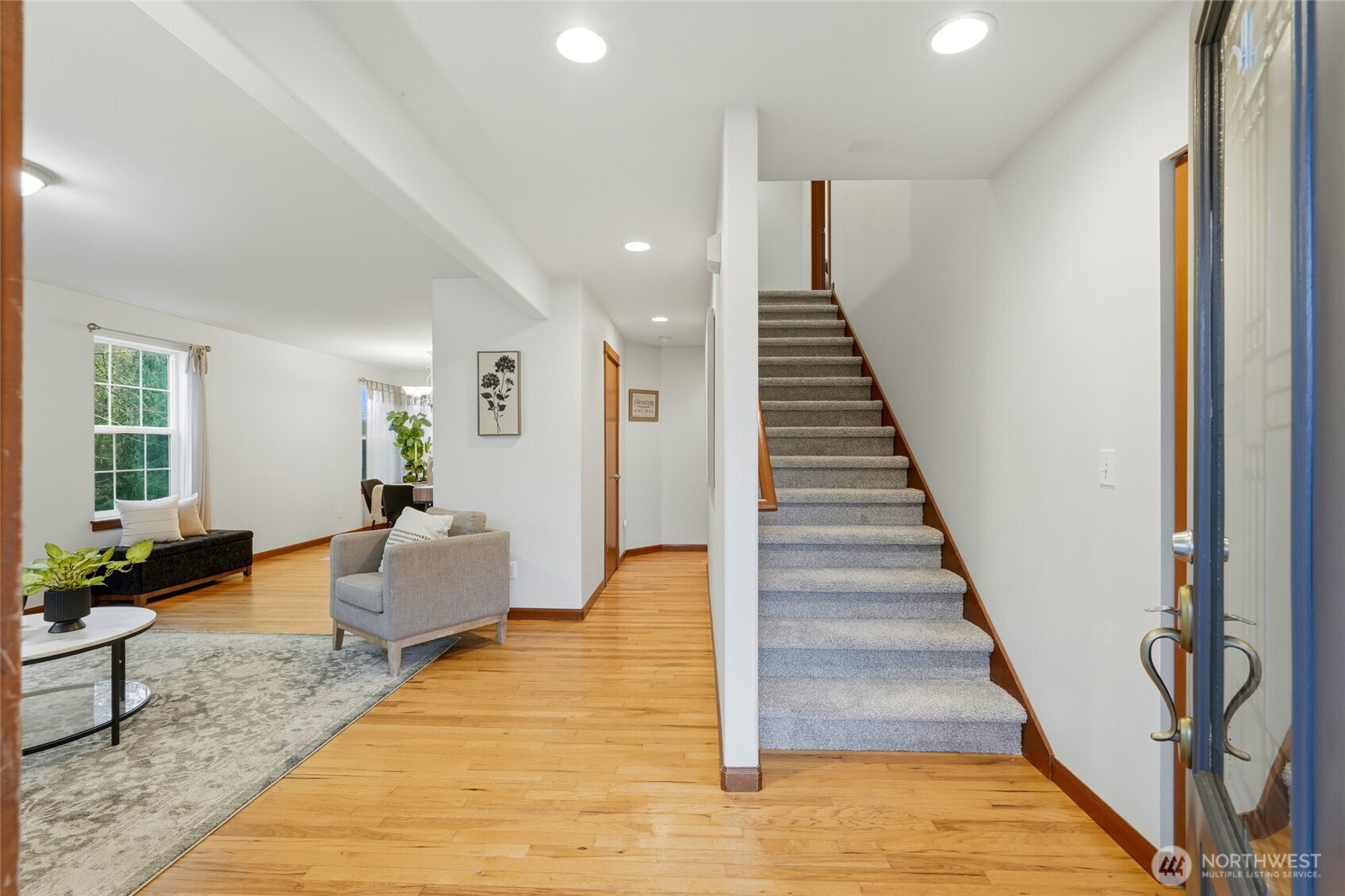 8017 64th Street Southeast Snohomish, WA 98290 - Photo 3 of 39 a view of entryway and hall with wooden floor