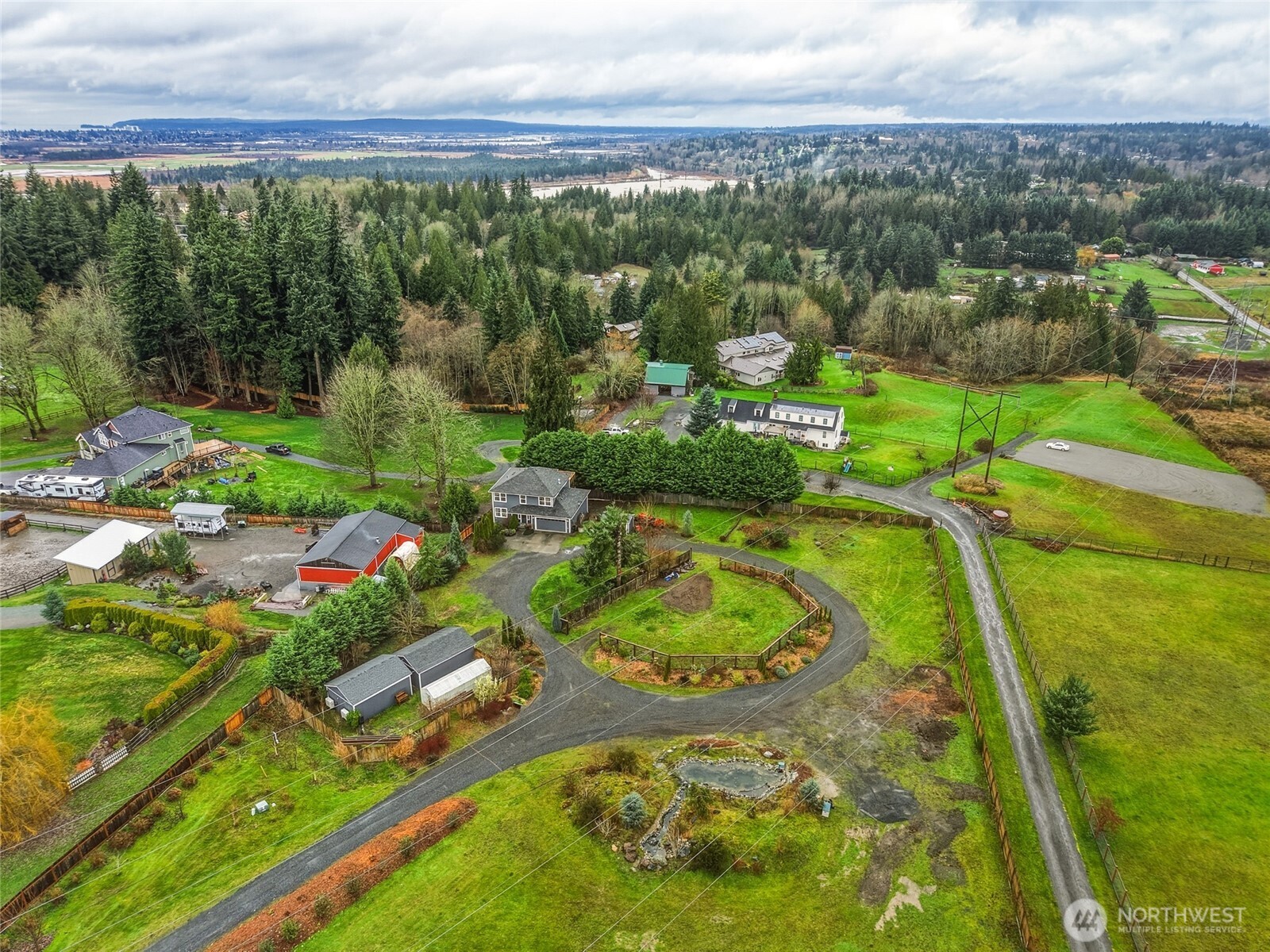 8017 64th Street Southeast Snohomish, WA 98290 - Photo 34 of 39 an aerial view of a house with a yard and lake view