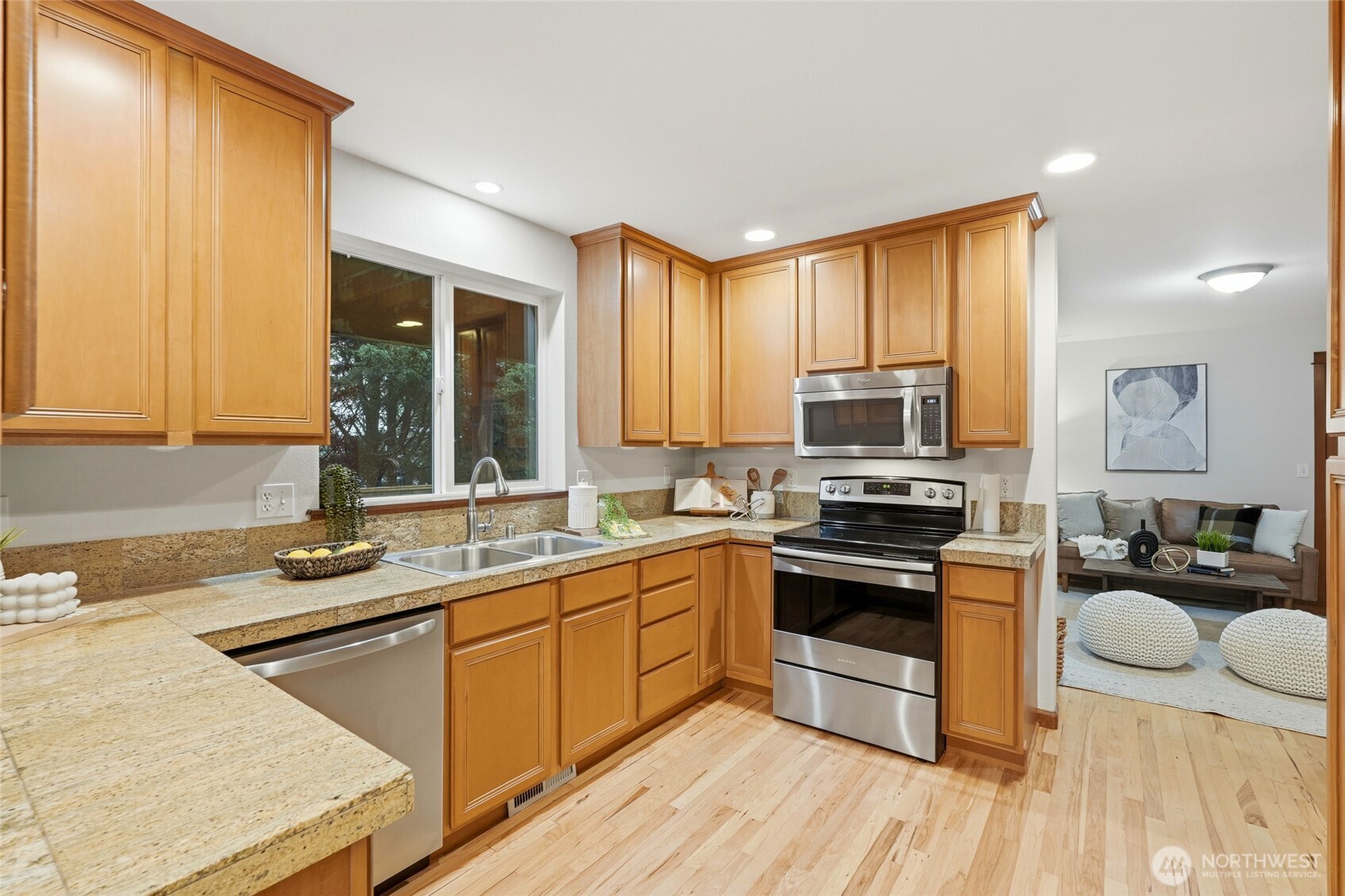 8017 64th Street Southeast Snohomish, WA 98290 - Photo 8 of 39 a kitchen with a sink stove and cabinets