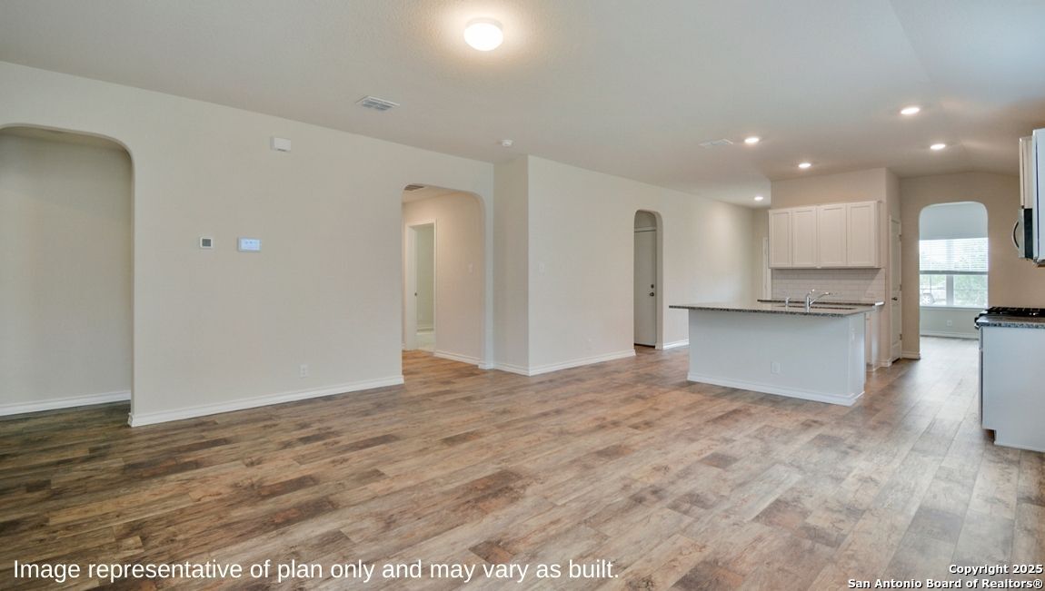 12820 El Arrayan Converse, TX 78109 - Photo 18 of 27 a view of a kitchen with a sink and an oven in a room