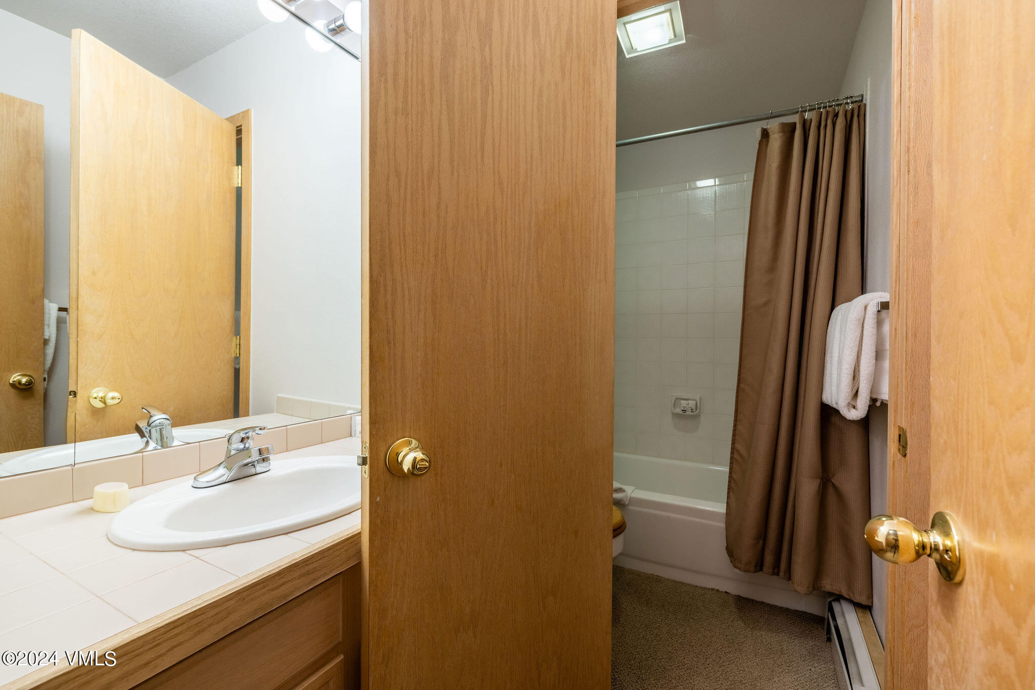 3891 Big Horn Road, Unit D Vail, CO 81657 - Photo 16 of 28 a bathroom with a sink and a mirror