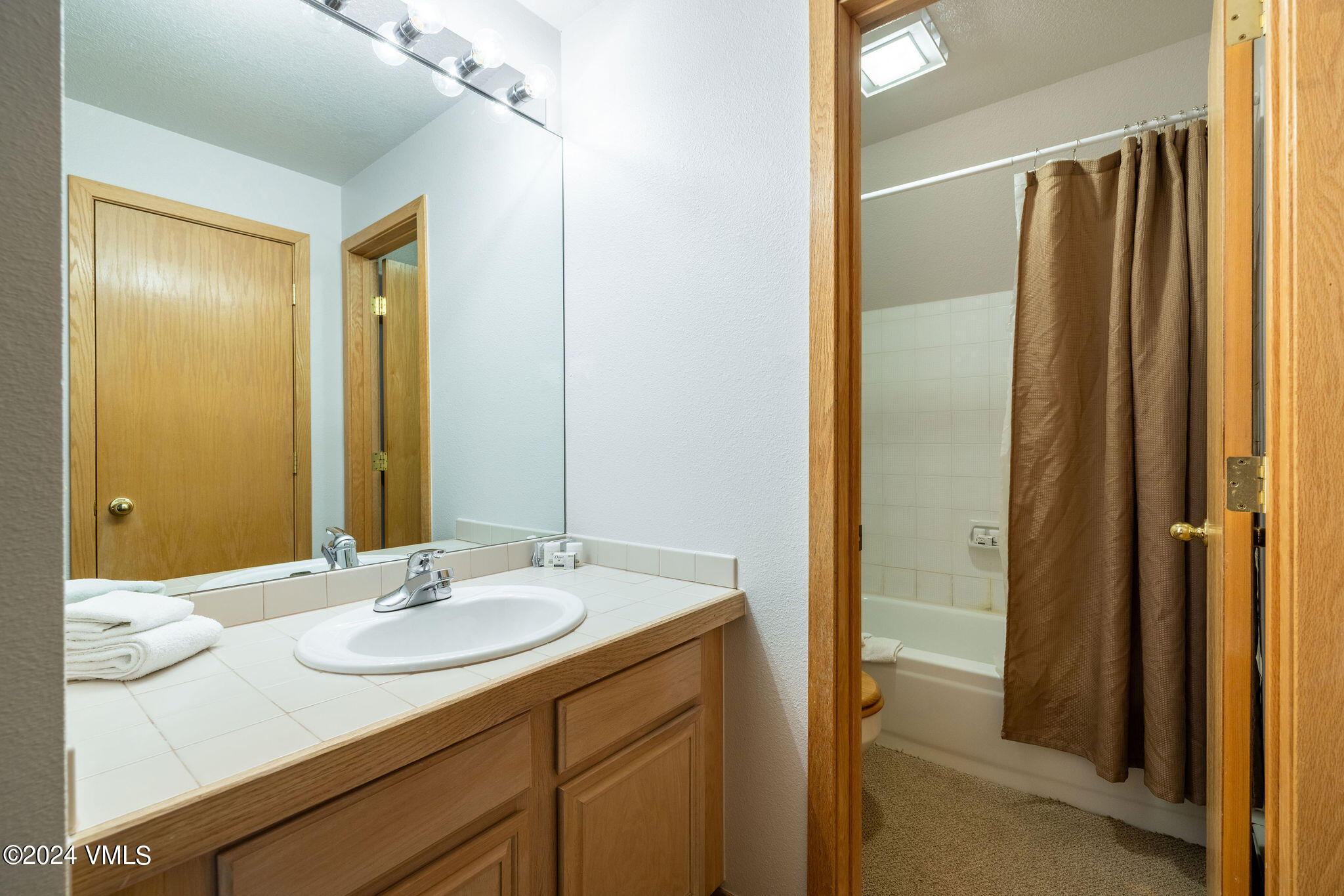 3891 Big Horn Road, Unit D Vail, CO 81657 - Photo 17 of 28 a bathroom with a sink and a mirror