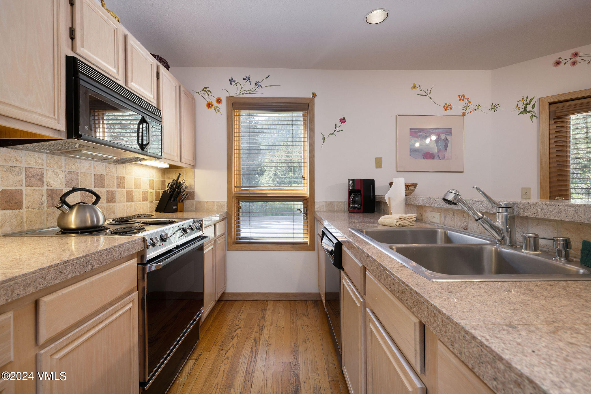 3891 Big Horn Road, Unit D Vail, CO 81657 - Photo 20 of 28 a kitchen with granite countertop a sink stove and cabinets
