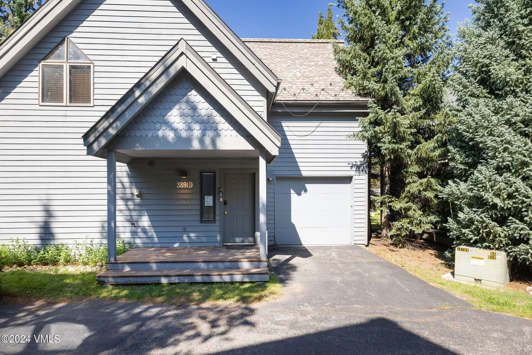 3891 Big Horn Road, Unit D Vail, CO 81657 - Photo 2 of 28 a front view of a house with garden