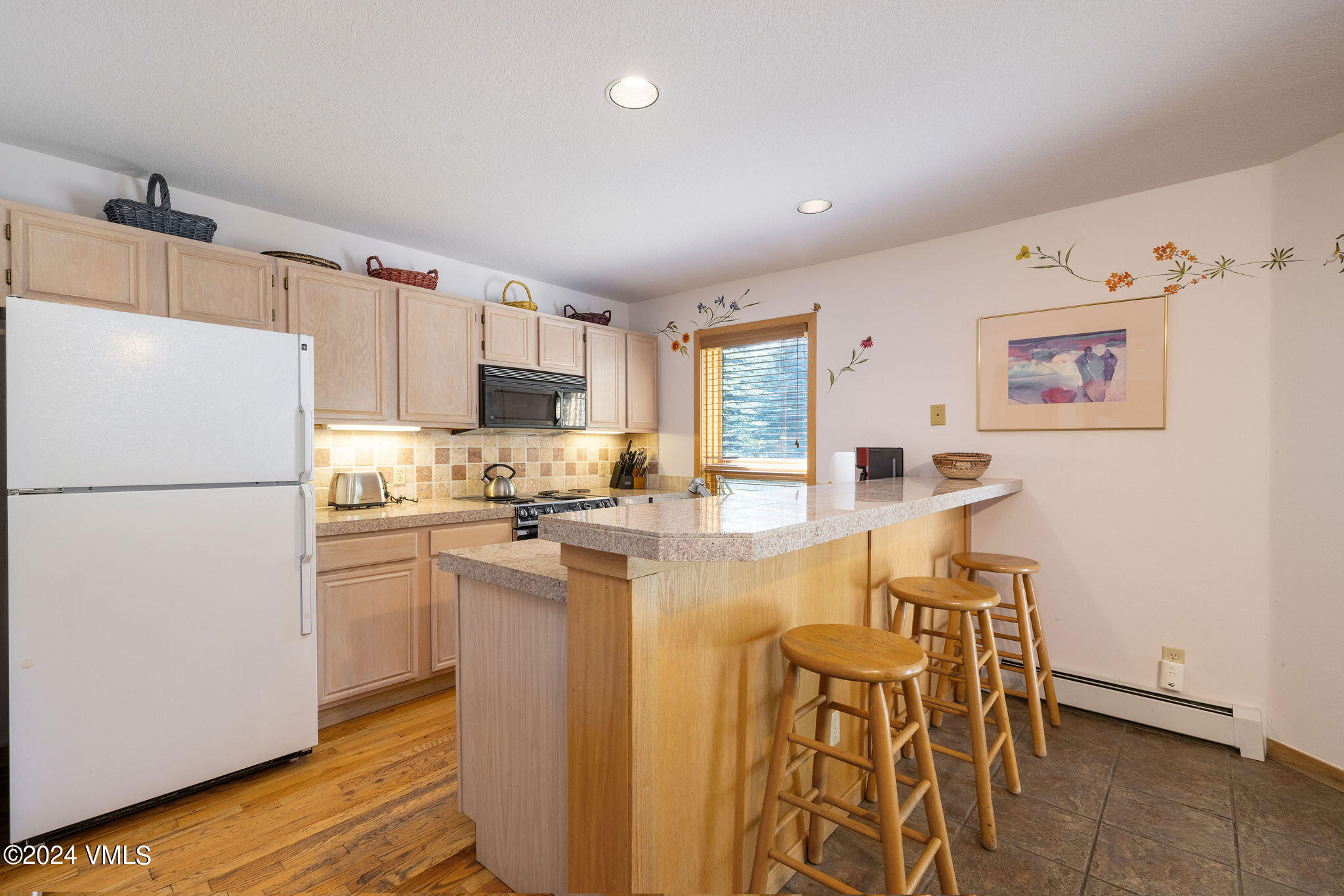 3891 Big Horn Road, Unit D Vail, CO 81657 - Photo 21 of 28 a kitchen with cabinets and stainless steel appliances