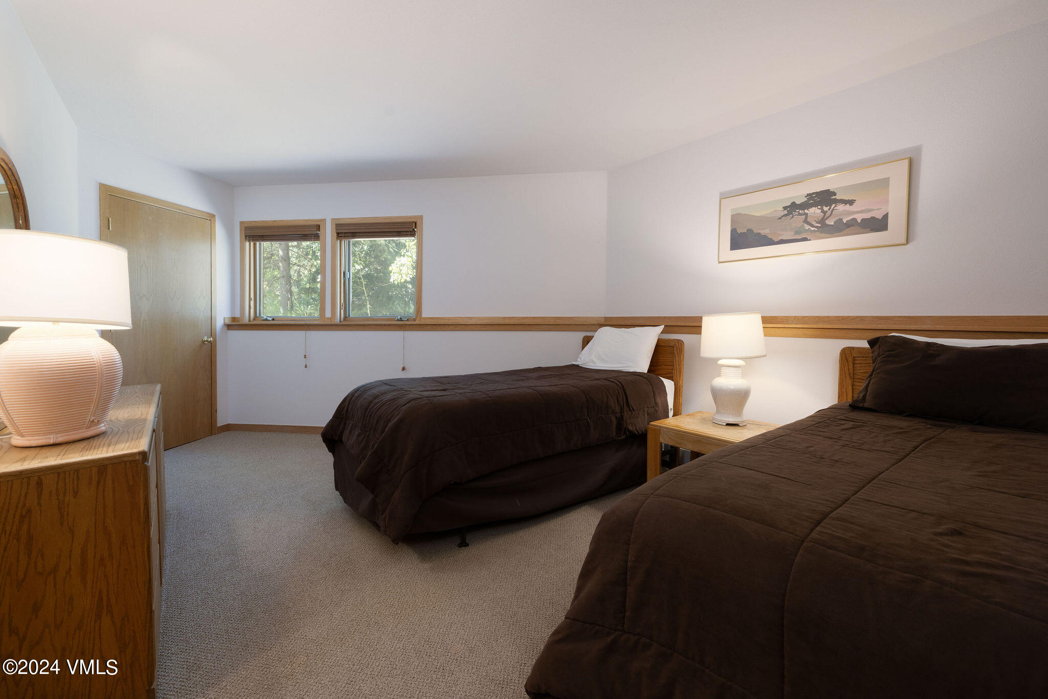 3891 Big Horn Road, Unit D Vail, CO 81657 - Photo 27 of 28 a bedroom with two beds and painting on the wall