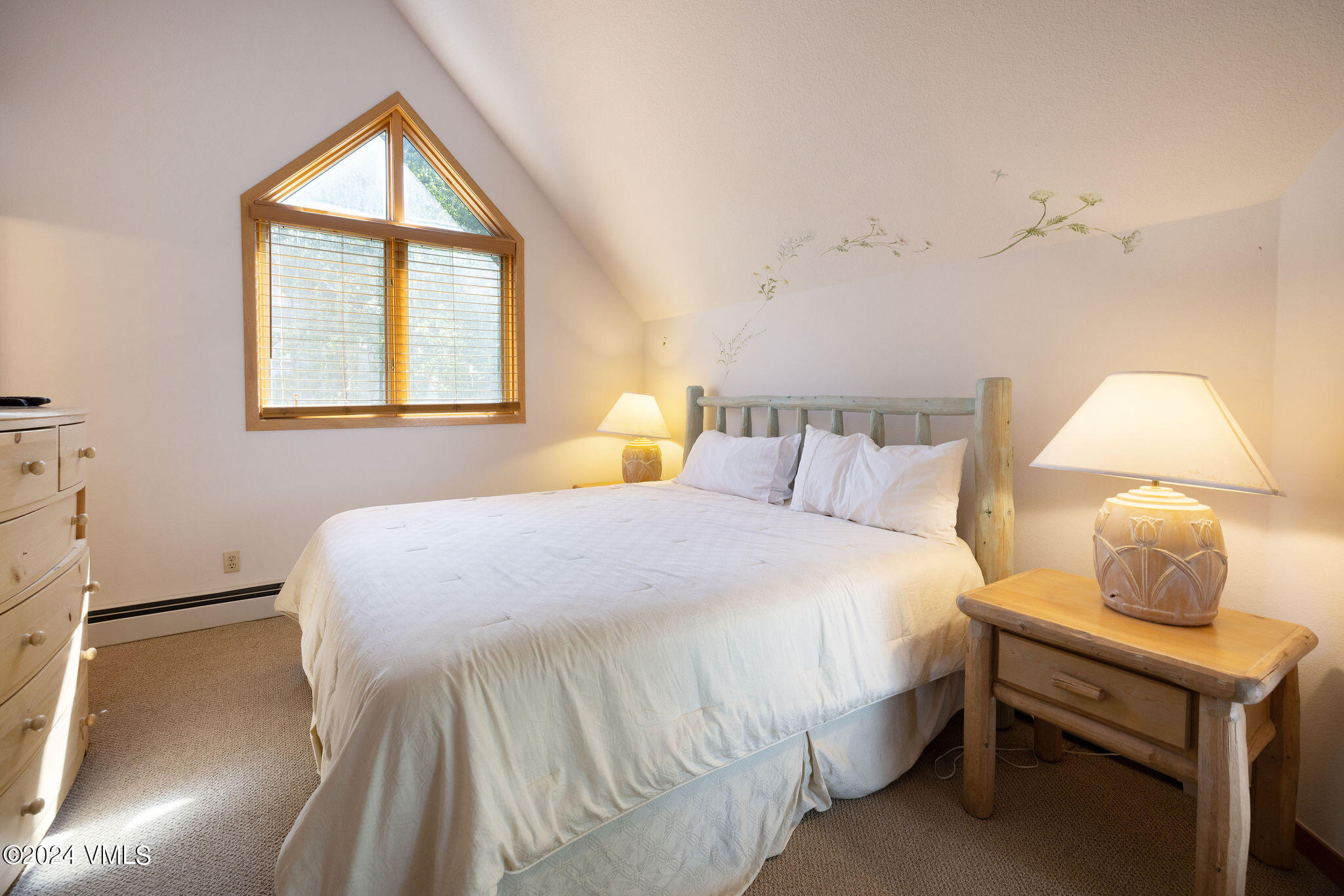 3891 Big Horn Road, Unit D Vail, CO 81657 - Photo 5 of 28 a bedroom with a bed and a window