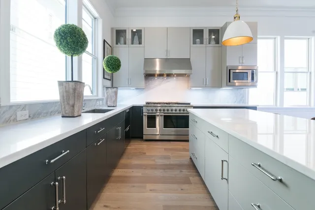 a kitchen with counter top space cabinets and stainless steel appliances