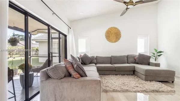 a living room with furniture and a window