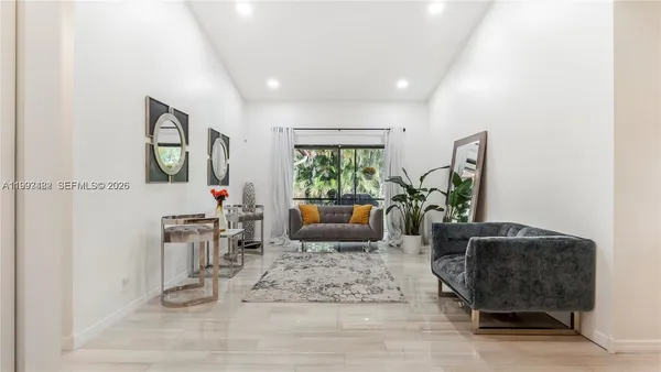 a living room with furniture and a window
