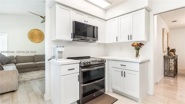 a kitchen with a stove and a microwave