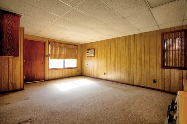 a view of an empty room with a window