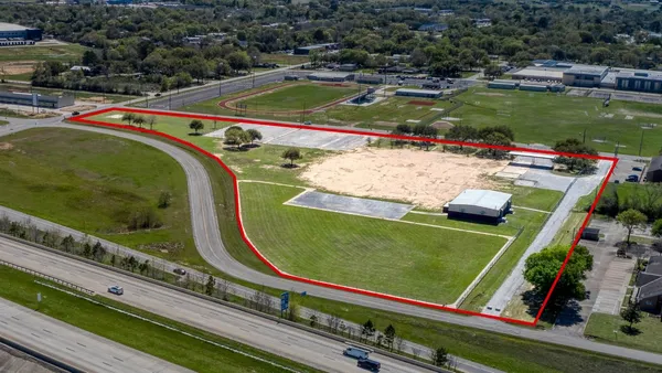 a view of swimming pool with a garden and seating area