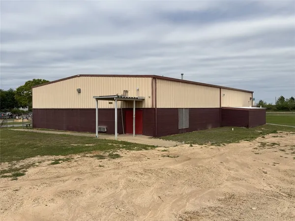 a view of a big house with a yard