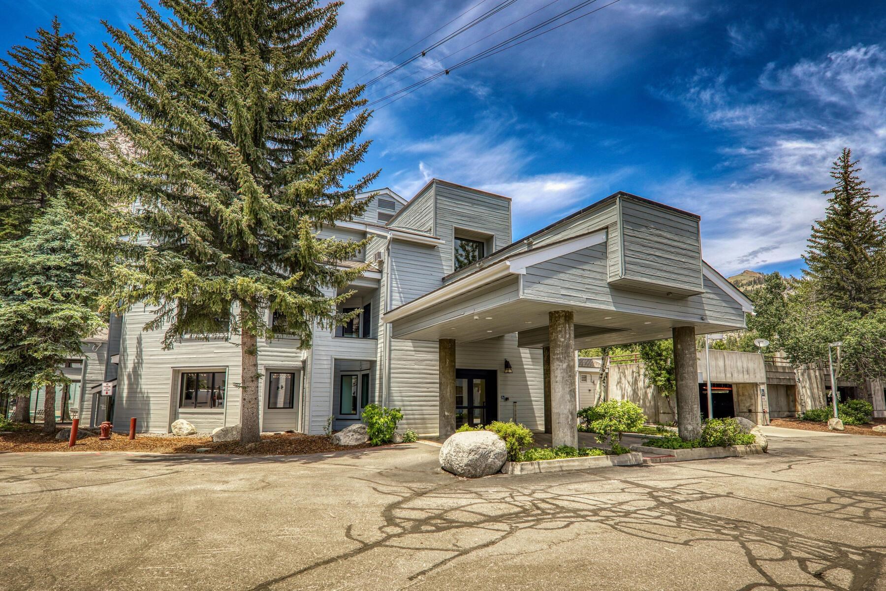 a front view of a house with garden and porch