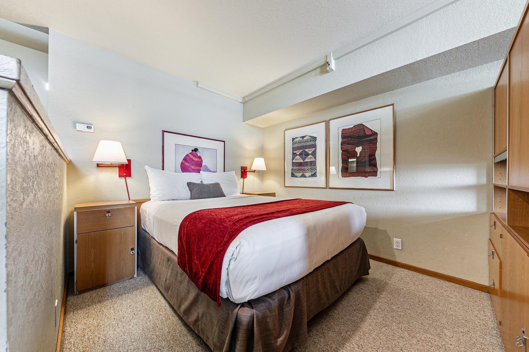 201 Shirley Cyn Road, Unit 311 Olympic Valley, CA 96146 - Photo 11 of 28 a spacious bedroom with a bed and wall painting