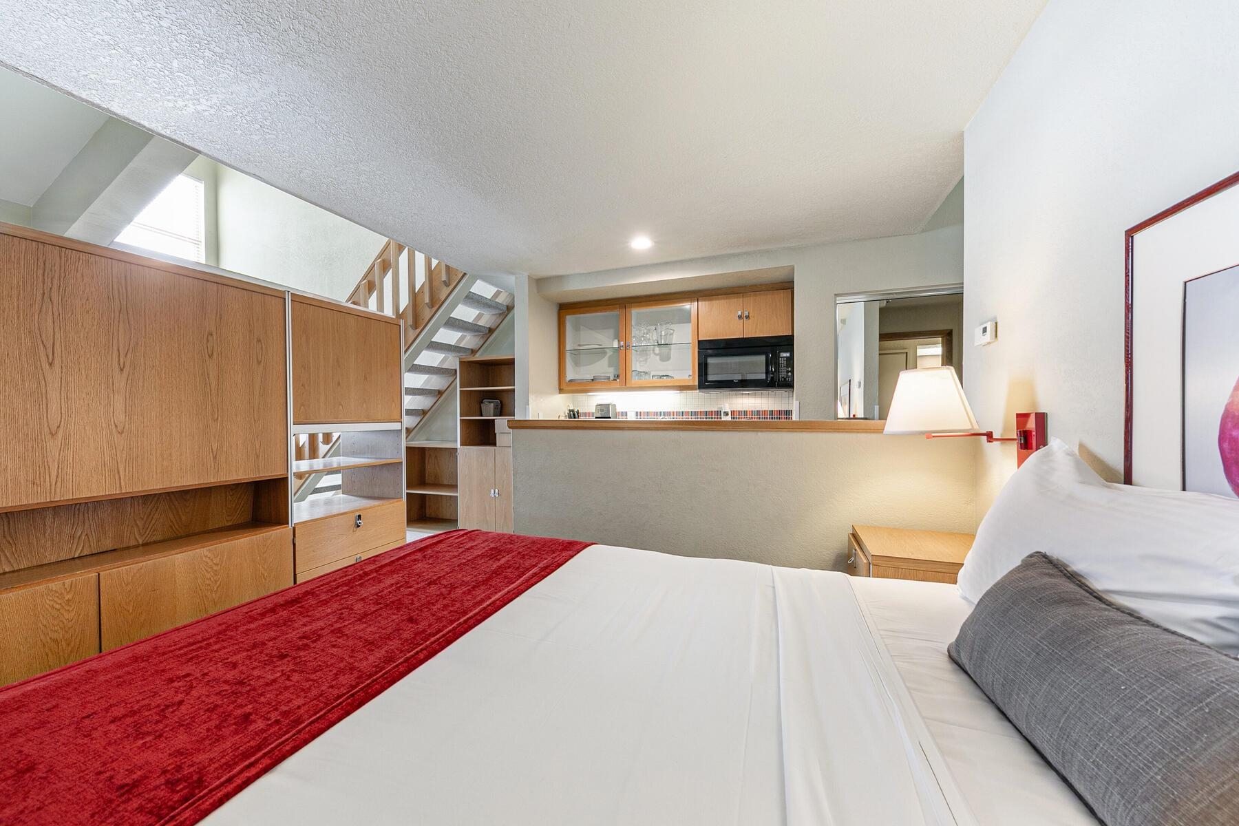 201 Shirley Cyn Road, Unit 311 Olympic Valley, CA 96146 - Photo 12 of 28 a kitchen with stainless steel appliances kitchen island granite countertop a refrigerator sink and microwave