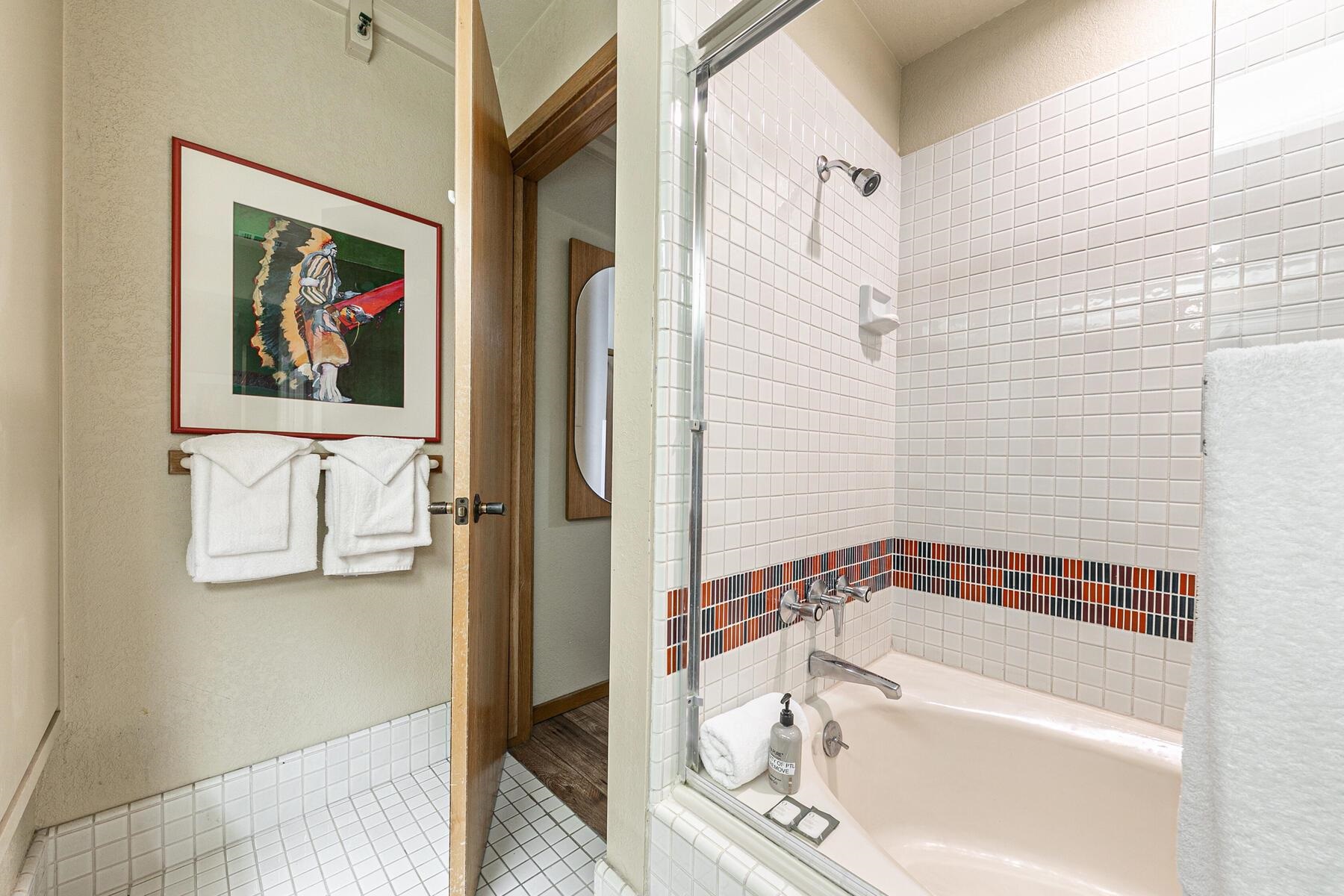 201 Shirley Cyn Road, Unit 311 Olympic Valley, CA 96146 - Photo 15 of 28 a bathroom with a bathtub and a shower