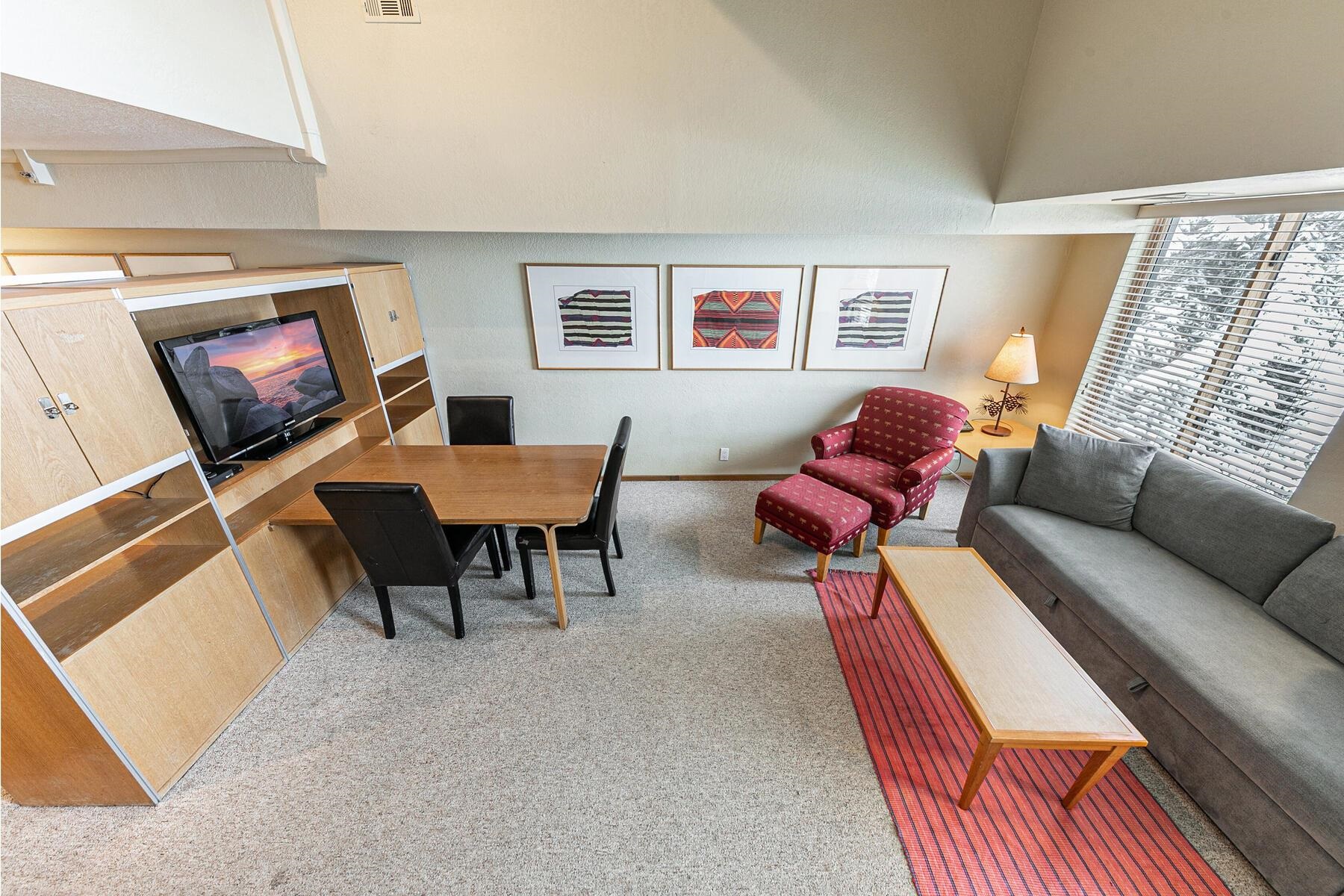 201 Shirley Cyn Road, Unit 311 Olympic Valley, CA 96146 - Photo 6 of 28 a living room with furniture and a flat screen tv