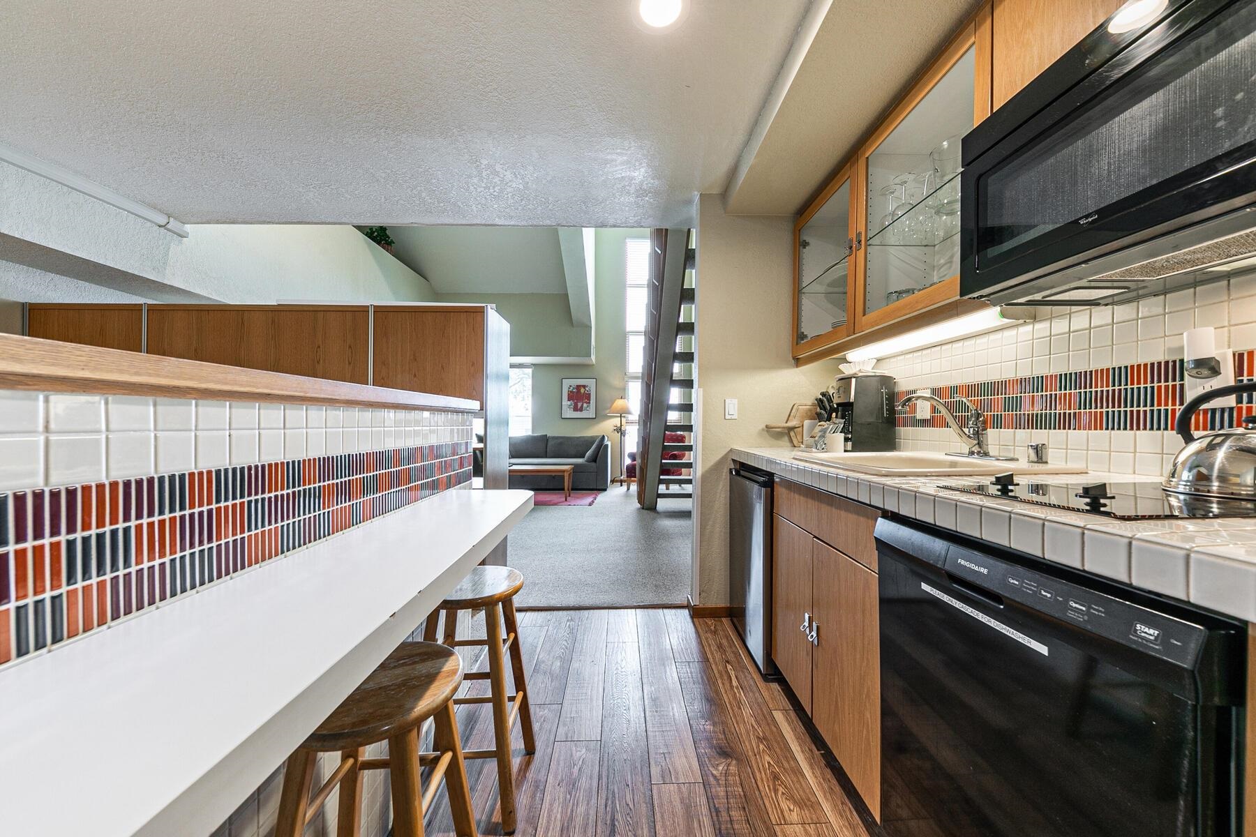 201 Shirley Cyn Road, Unit 311 Olympic Valley, CA 96146 - Photo 8 of 28 a kitchen with stainless steel appliances a sink a stove and cabinets