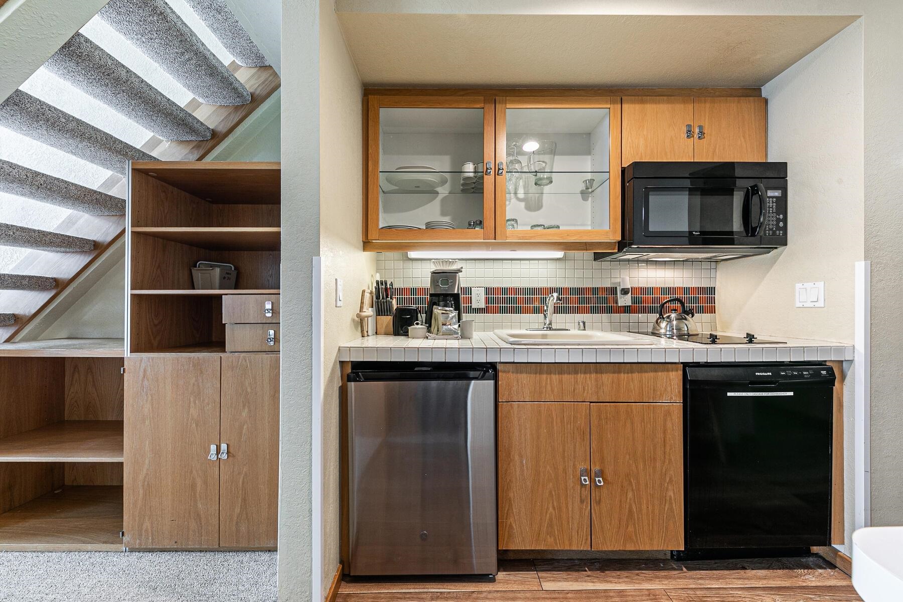 201 Shirley Cyn Road, Unit 311 Olympic Valley, CA 96146 - Photo 10 of 28 a kitchen with stainless steel appliances granite countertop a refrigerator and a stove top oven