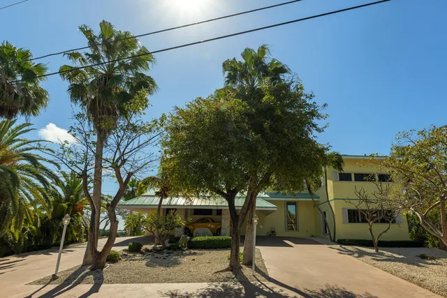 a living room with furniture a large window with outer view