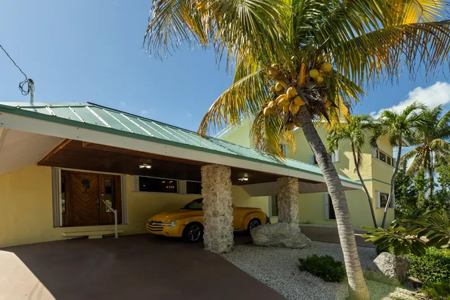 a kitchen with stainless steel appliances kitchen island granite countertop a sink and cabinets