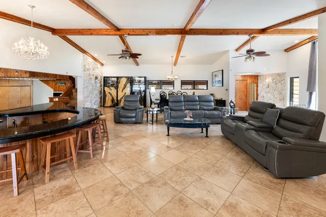 a view of a chairs and table in a balcony