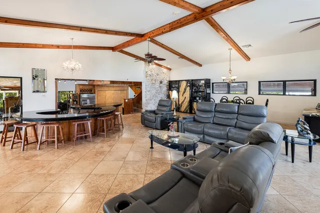 a lobby with furniture and large windows