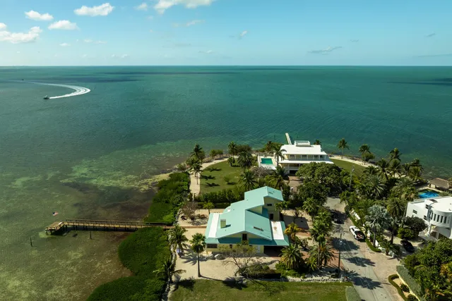 an aerial view of a houses with outdoor space