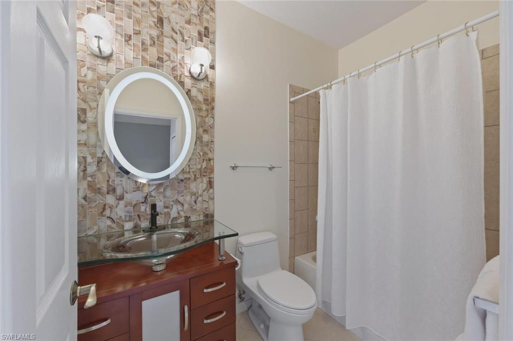 7577 Bristol Circle Naples, FL 34120 - Photo 18 of 41 a bathroom with a toilet and a sink