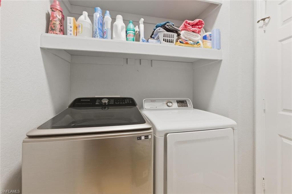 7577 Bristol Circle Naples, FL 34120 - Photo 27 of 41 a utility room with dryer and washer